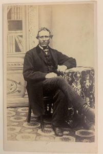 Portrait of William Graham seated.