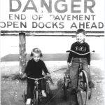 Linda and Doug Cory In Front of Danger Sign