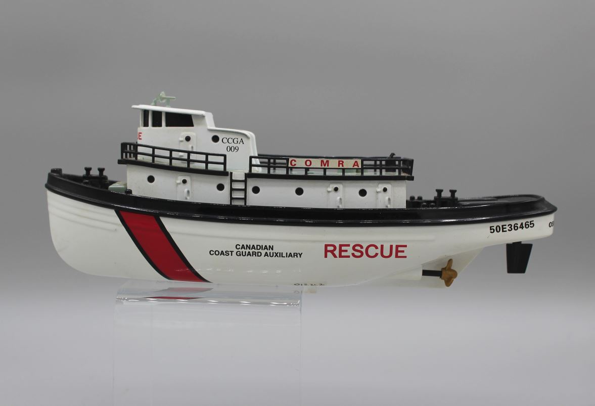 Colour photograph of a metal diecast boat called COMRA.