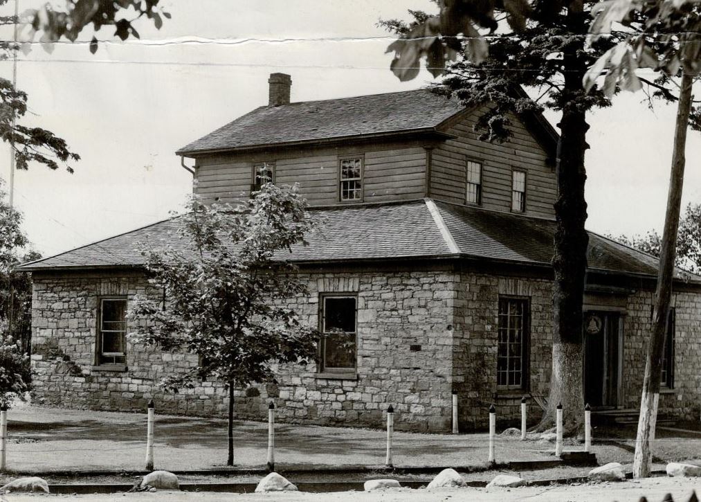 Black and white photograph of a stone house.