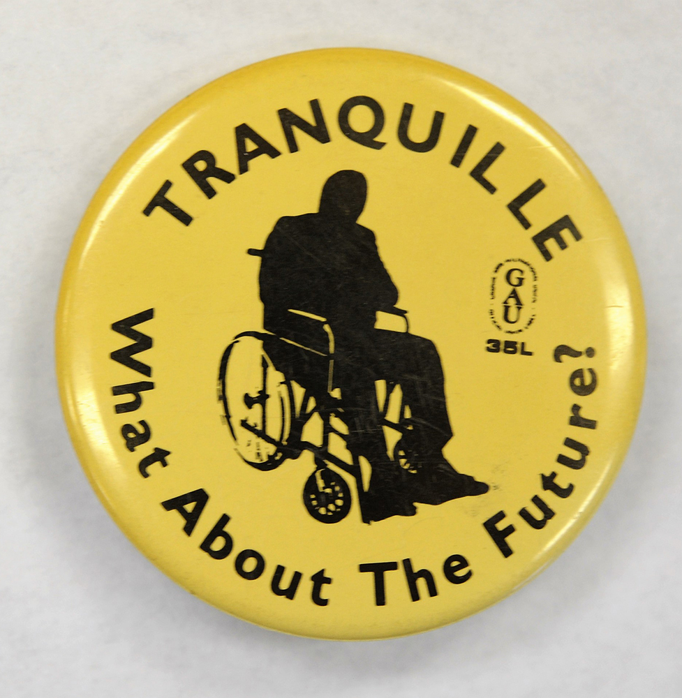 A yellow and black button with an image of a person in a wheelchair reads Tranquille What About the Future?