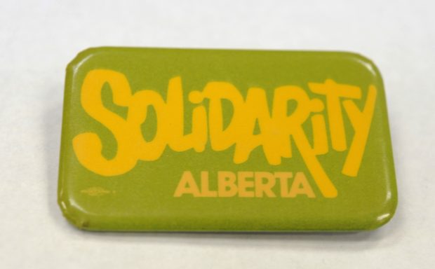 A green and yellow button reads “Solidarity Alberta”