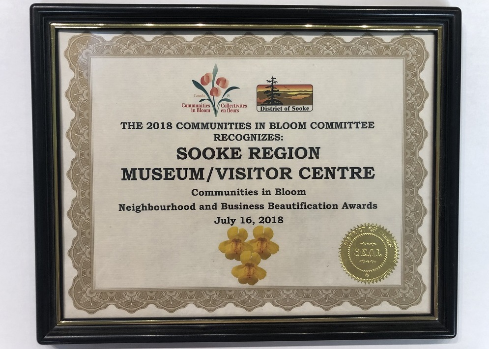 A Certificate recognizing the Sooke Region Museum and Visitor Centre for the Neighborhood and Business Beautification Awards by the Communities in Bloom organization, 2018.
