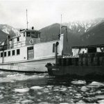 SS Beaton on Icy Water with Barge, 1953