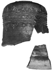Black and White photo of Bell top and fragment of the base. Decorated in it's entirety with various line and geometric patterns.