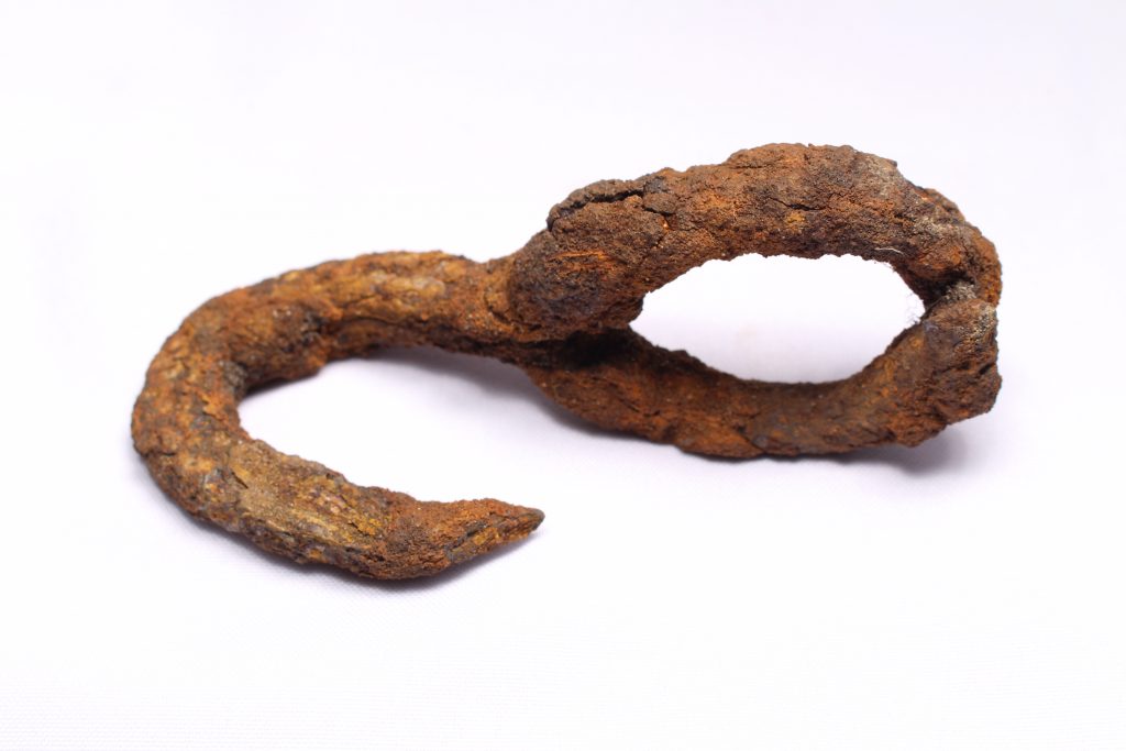Rusty Iron hook with a circular attachment