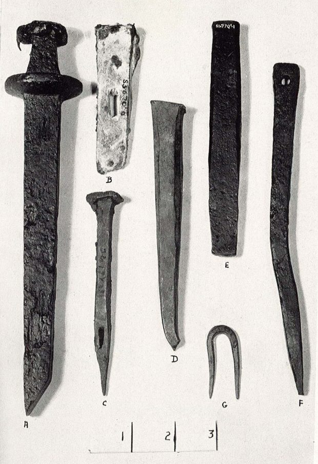 Seven rusted iron objects ranging in shape and size found during excavations including one dagger.