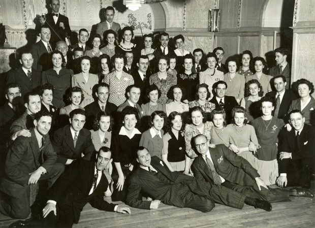 A group of Bruck Mills employees posing at a party at Maison Bruck in 1944.