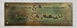 Commemorative brass plaque engraved with the inscription 