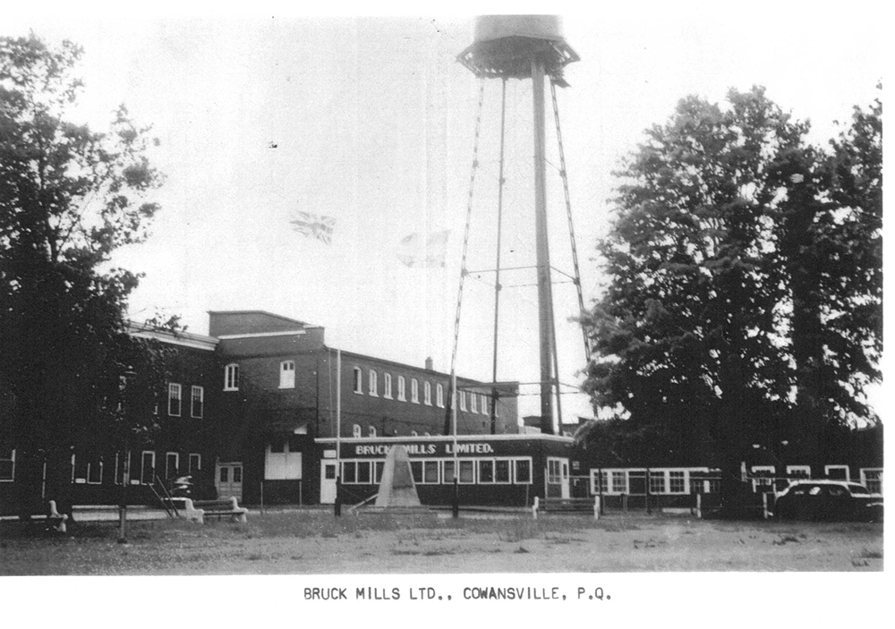 Facade of the Bruck Mills Limited factory and water tower around 1947.