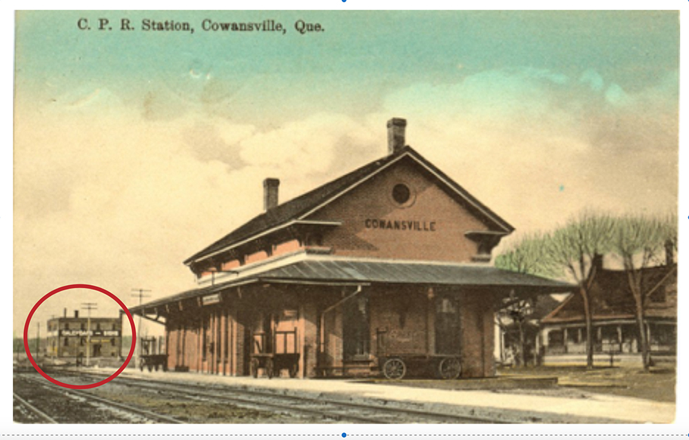 Cowansville station with Bruck Silk Mills offices in the background.