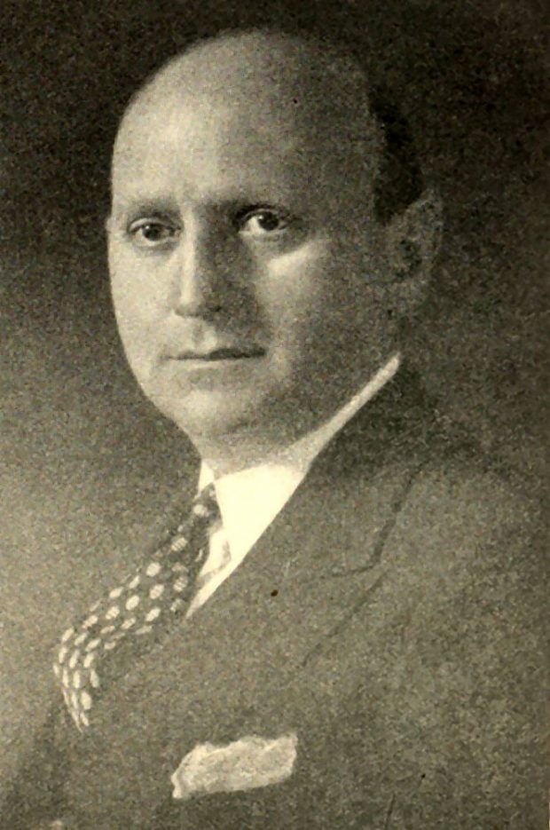 Black and white portrait of young man (Isaac Bruck), in suit and tie.