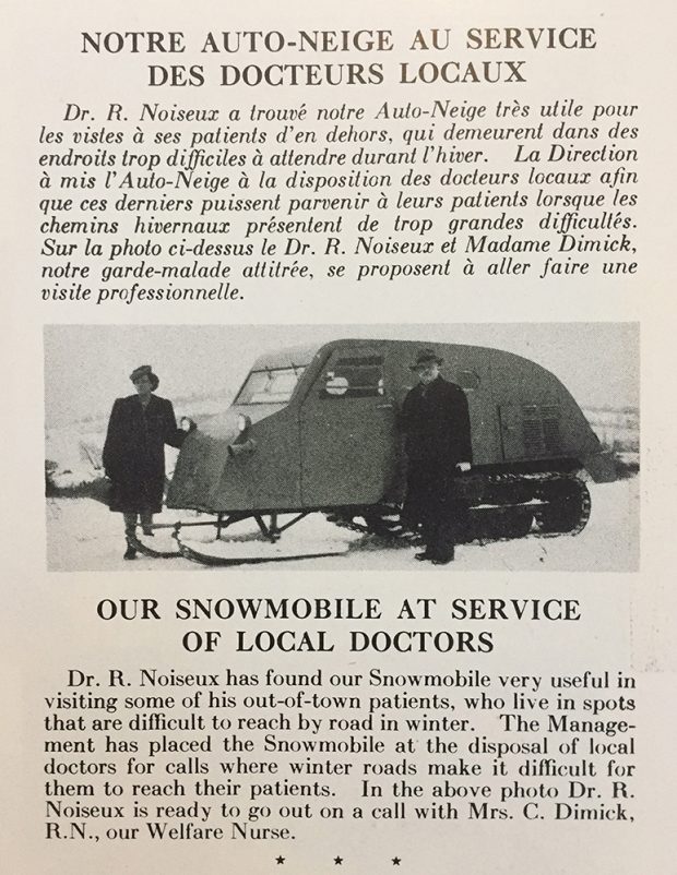 Newspaper article showing two people in winter coats in front of an old snowmobile.