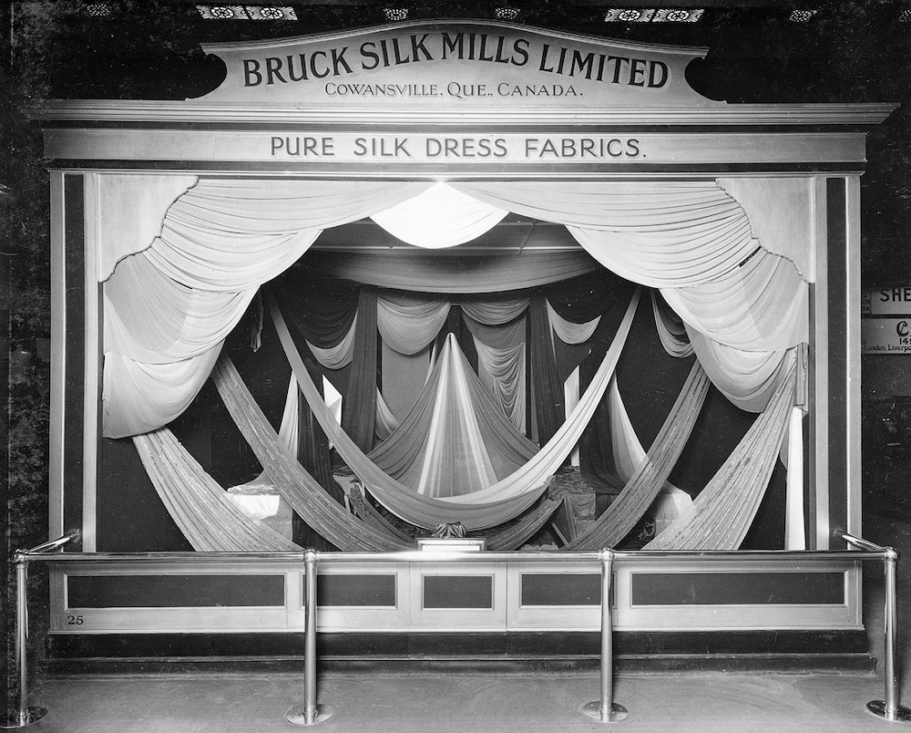 Trade show booth displaying fabrics placed for exhibition.