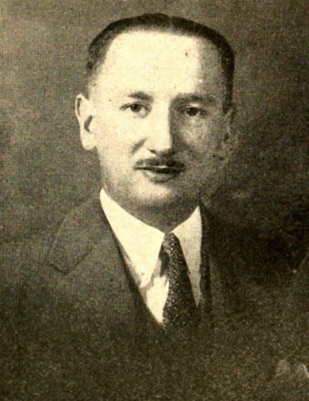 Black and white portrait of a young man (Leopold S. Lee) in suit and tie and wearing a mustache.