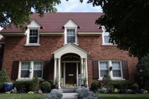 Photograph of a brick home.