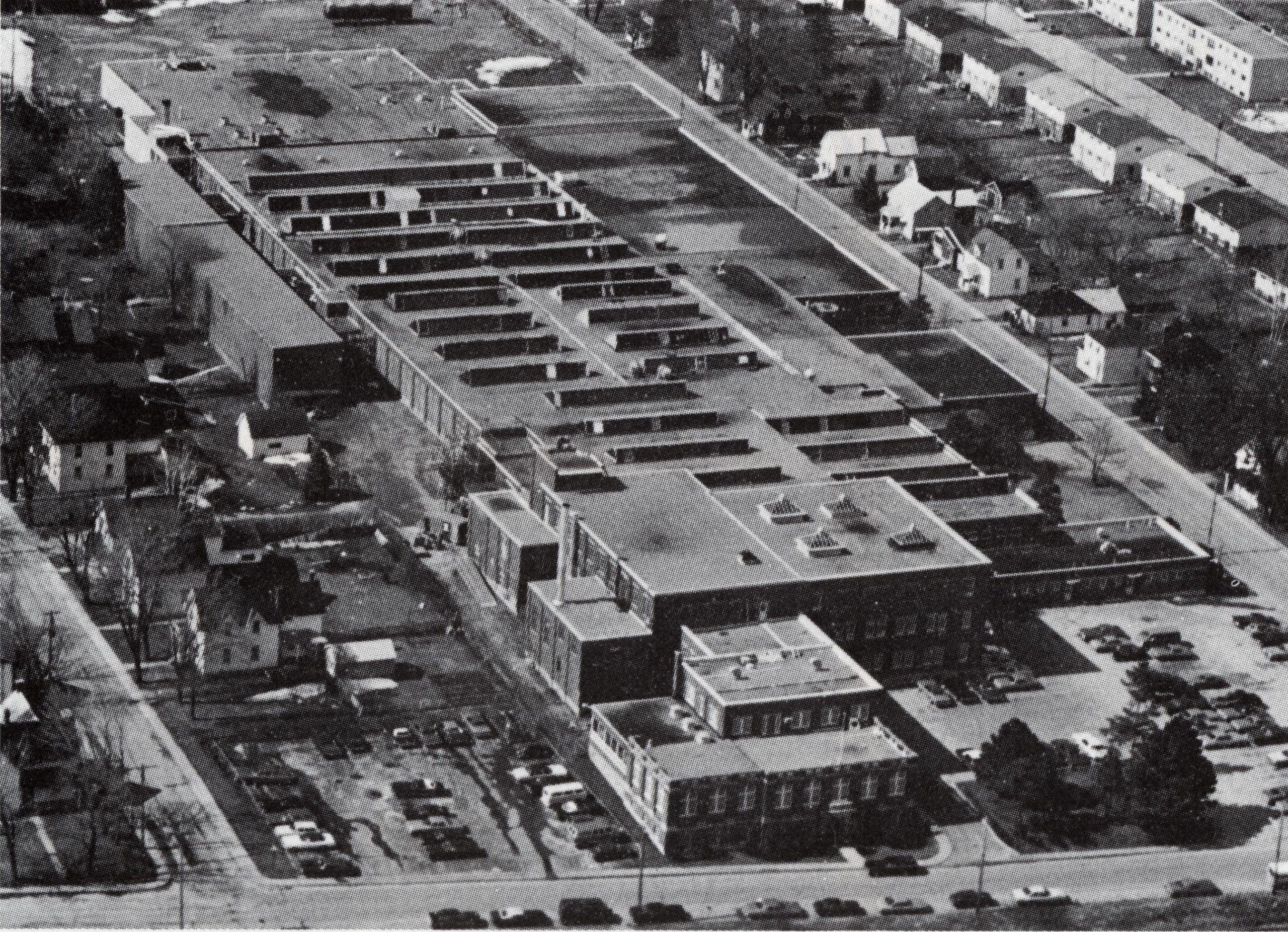 Black and white photograph of a factory.