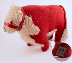 A red and white stuffed bull.