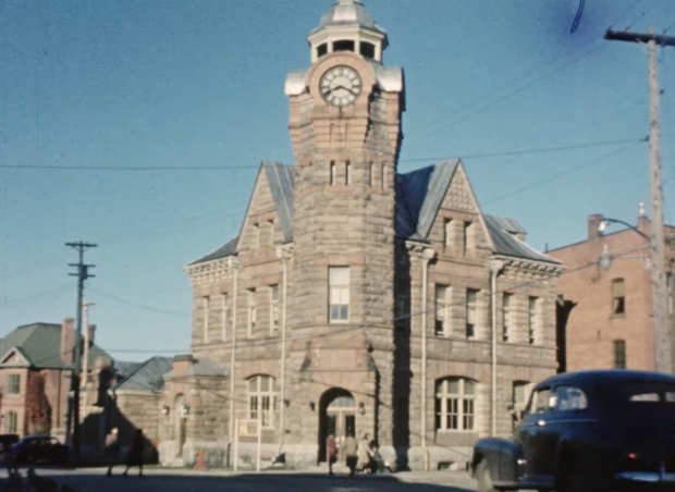 A coloured photo of a stone building.