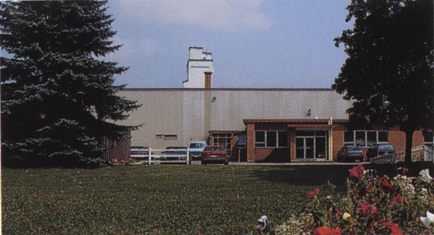 Coloured photo of factory building.