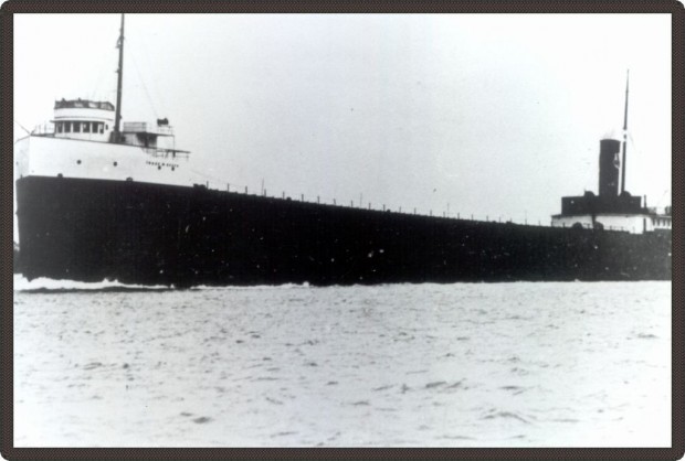 Black and white photo of a long boat