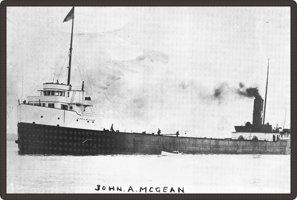 Black and white photo of a long steamboat