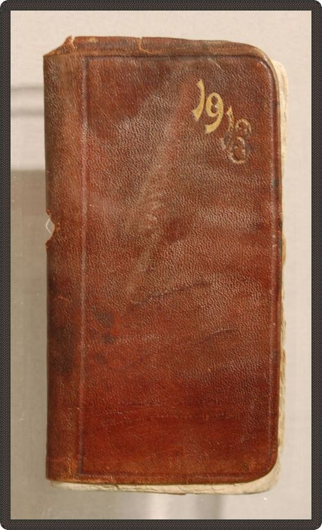 Leather logbook with 1913 in gold on the cover