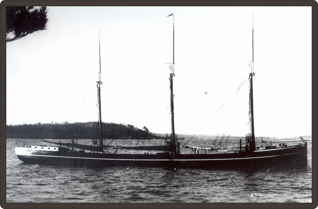 Black and white photo of a long steamboat