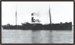 Black and white photo of a long steamboat
