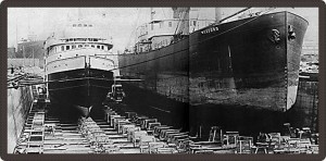 Black and white photo of two boats on dry land. 