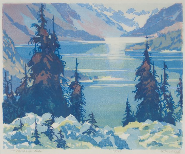 Block print of a lake in a mountain valley with trees and rocks in the foreground.