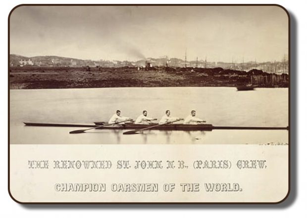 Image of the Paris Crew team members rowing together on a body of water. This sepia tone photograph shows team together in Saint John, New Brunswick following their win at the International Rowing Regatta in Paris, France. Behind them on the shore line shows a riverbank with scattered trees and houses. Under the photo shows a caption with reads The Renowned St. John, New Brunswick, Paris Crew, Champion Oarsmen of the world.