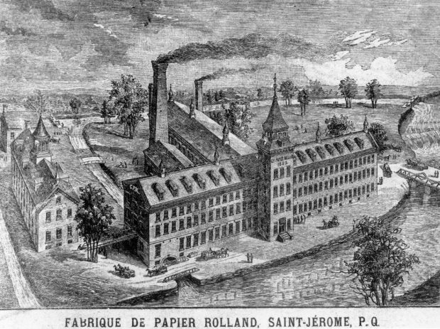 Black & white engraving showing the mill at Saint-Jérôme, beside the Rivière du Nord. The main building, with its tower, as well as the rear wing and smokestacks are seen.
