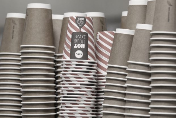 Colour photograph of piles of coffee cups.