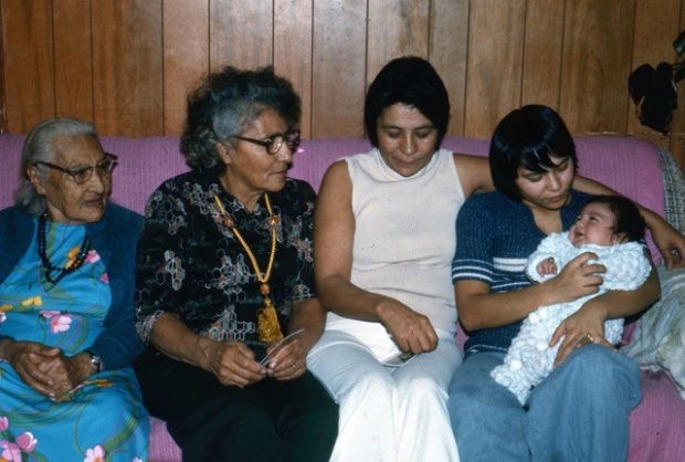 A group of women sitting on the pink sofa on the farthest left is Granny Powder, Katy Sanderson and their children with five generations of women.