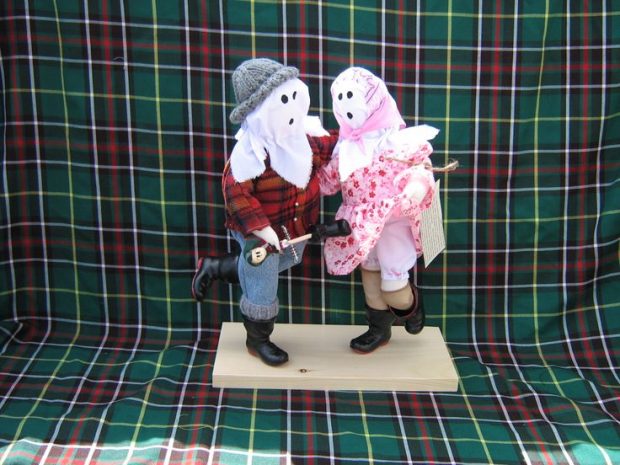 Craft representation of two Mummers dancing