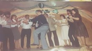 a group of young people dancing on stage at a Paddy's dance concert