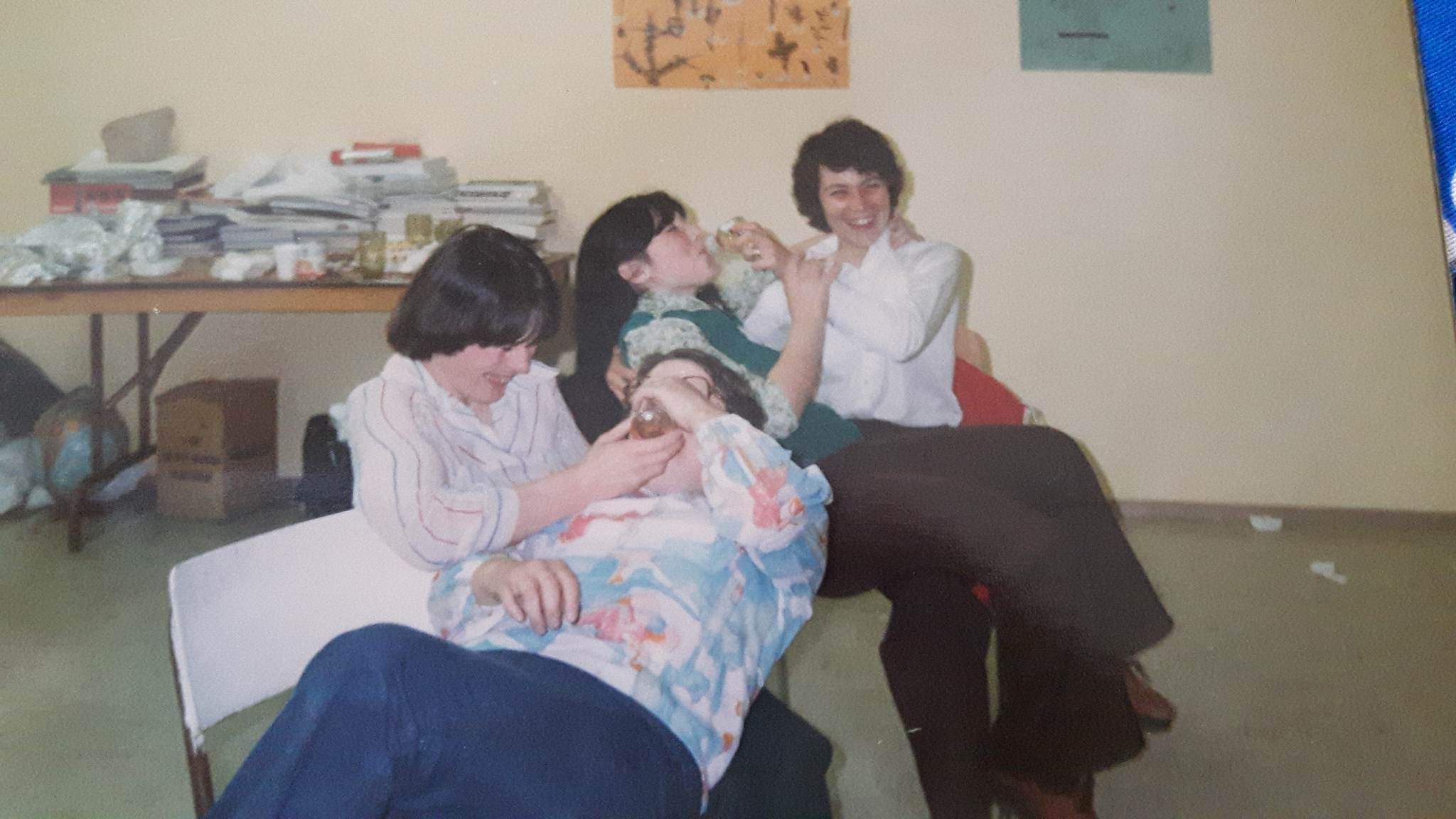 Some women play a game feed the baby at a baby shower