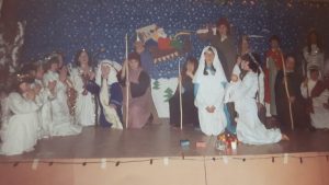 A group of school children perform in a Nativity scene in a Christmas concert