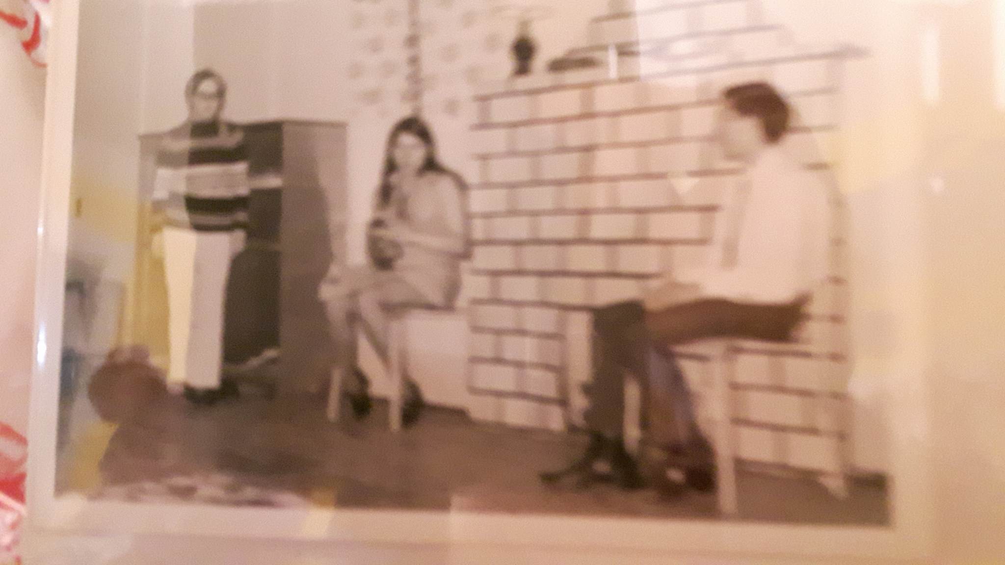 Two teenage girls and a teenage boy perform a skit in a Paddy's Day concert in 1971