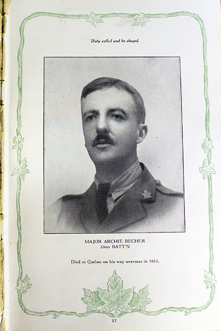 Photograph of a page in a book showing the portrait of a soldier wearing a tie. There are writings on top and at the bottom, the edges are decorated with a vine and maple leaves.