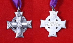 A silver Greek cross, obverse: royal cypher in centre and maple leaves at the end of each arm, a laurel wreath behind the cross; reverse: the same cross, flat, with a number the name of a private engraved in.
