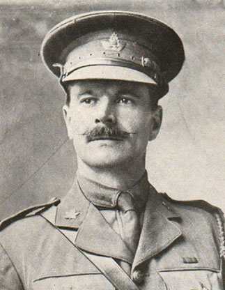 Portrait of a soldier wearing a peak hat. He has a moustache.