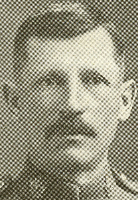 Portrait of a soldier with a moustache.
