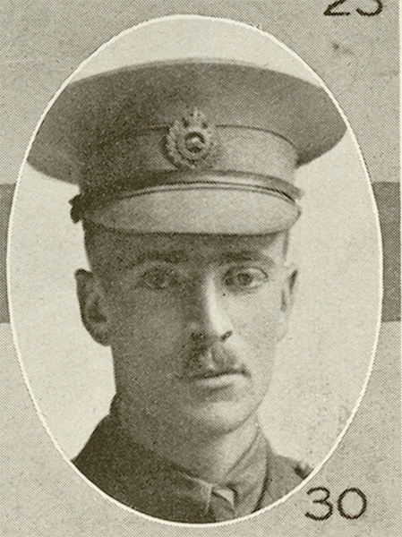 Portrait of a soldier wearing a peak hat. He has a moustache.