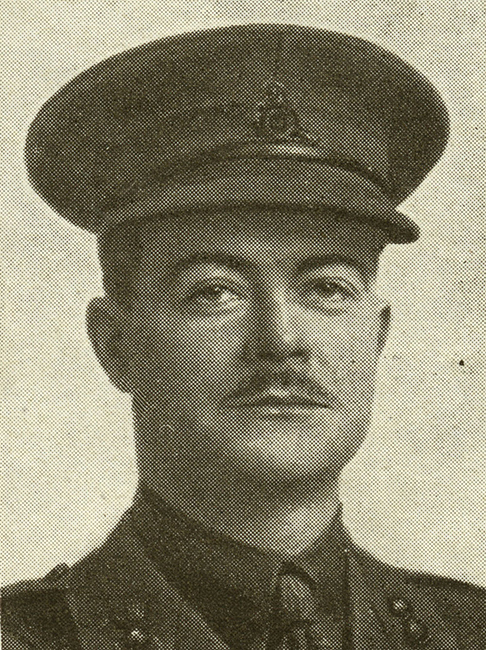 Portrait of a soldier wearing peak hat. He has a moustache.