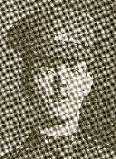 Portrait of a soldier wearing a peak hat. He has a moustache.