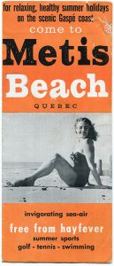 Cover of the tourist pamphlet of Metis Beach. On an orange background is written, in an alternation of black and white for relaxing, healthy summer holidays on the scenic Gaspé coast come to Metis Beach Quebec invigorating sea - air free from hayfever summer sports golf - tennis - swimming. A black and white photograph of a young woman in a bathing suit sitting on the beach divides the text into two sections.