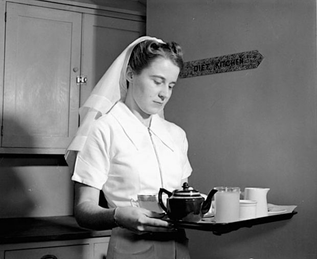 Nursing Sister carrying a tea tray