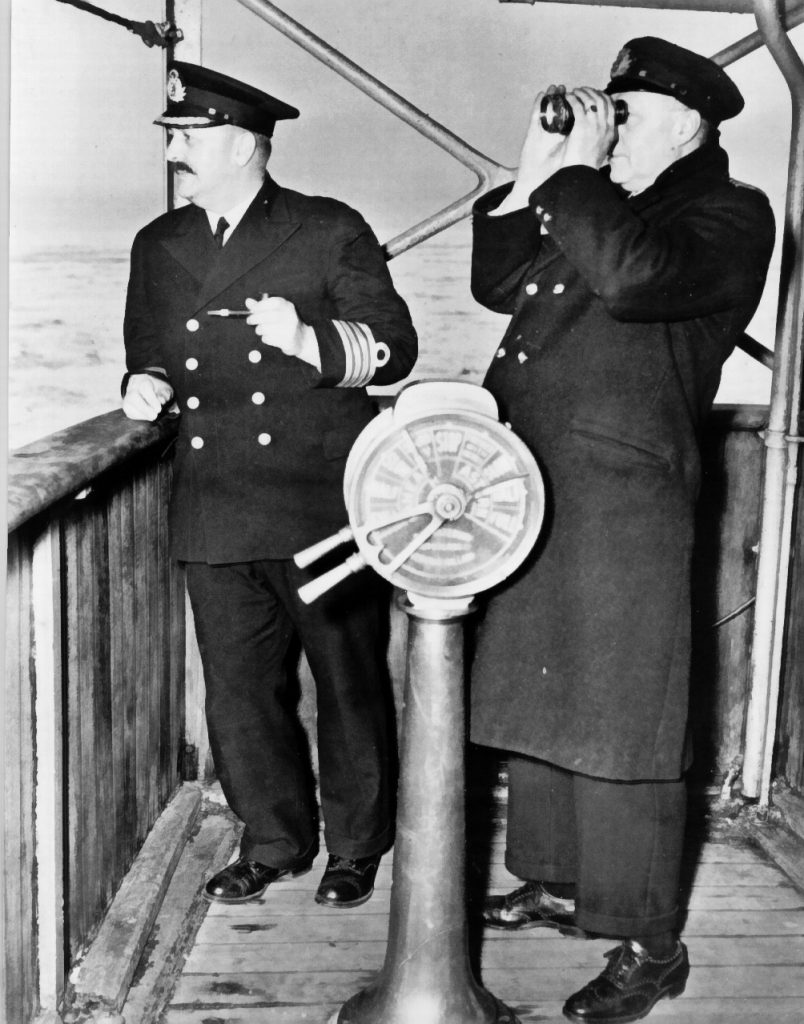 Captain and crewman on bridge of ship